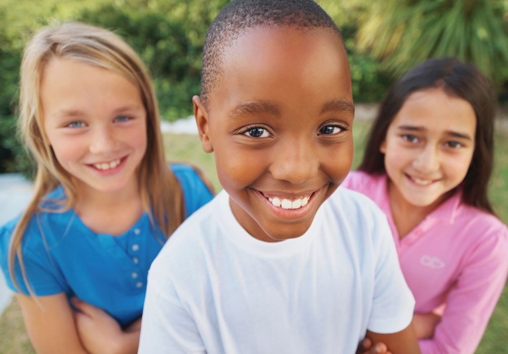 Smiling group of diverse children outdoors